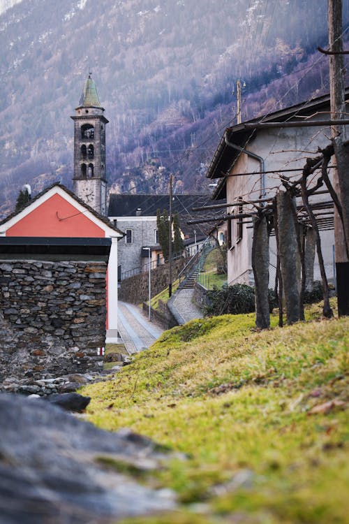 Free Houses and Church in a Mountain Valley Village  Stock Photo
