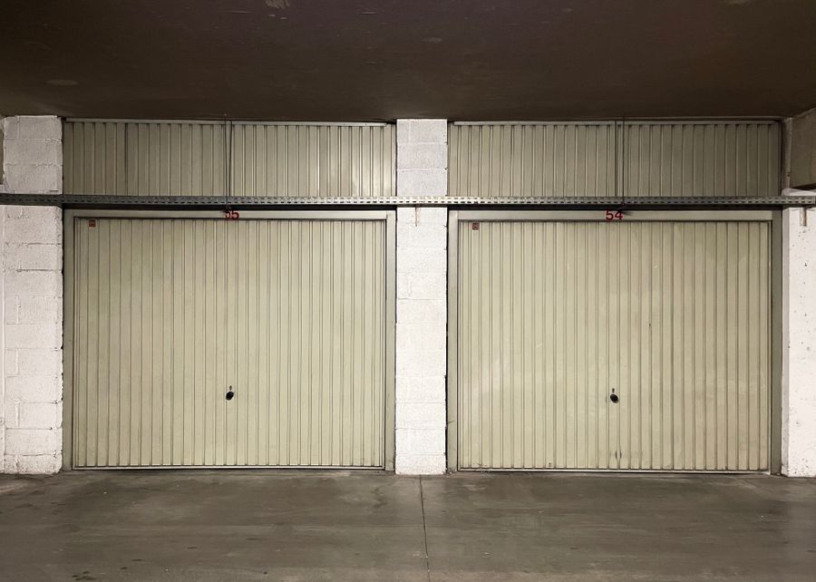 Technician performing garage door repair on a residential home in Oxford, Ohio