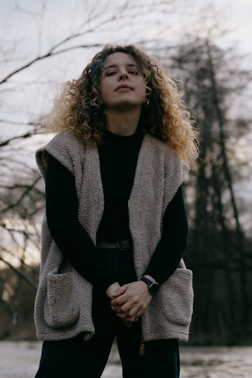 A Woman with Curly Hair Wearing a Fleece Sweater