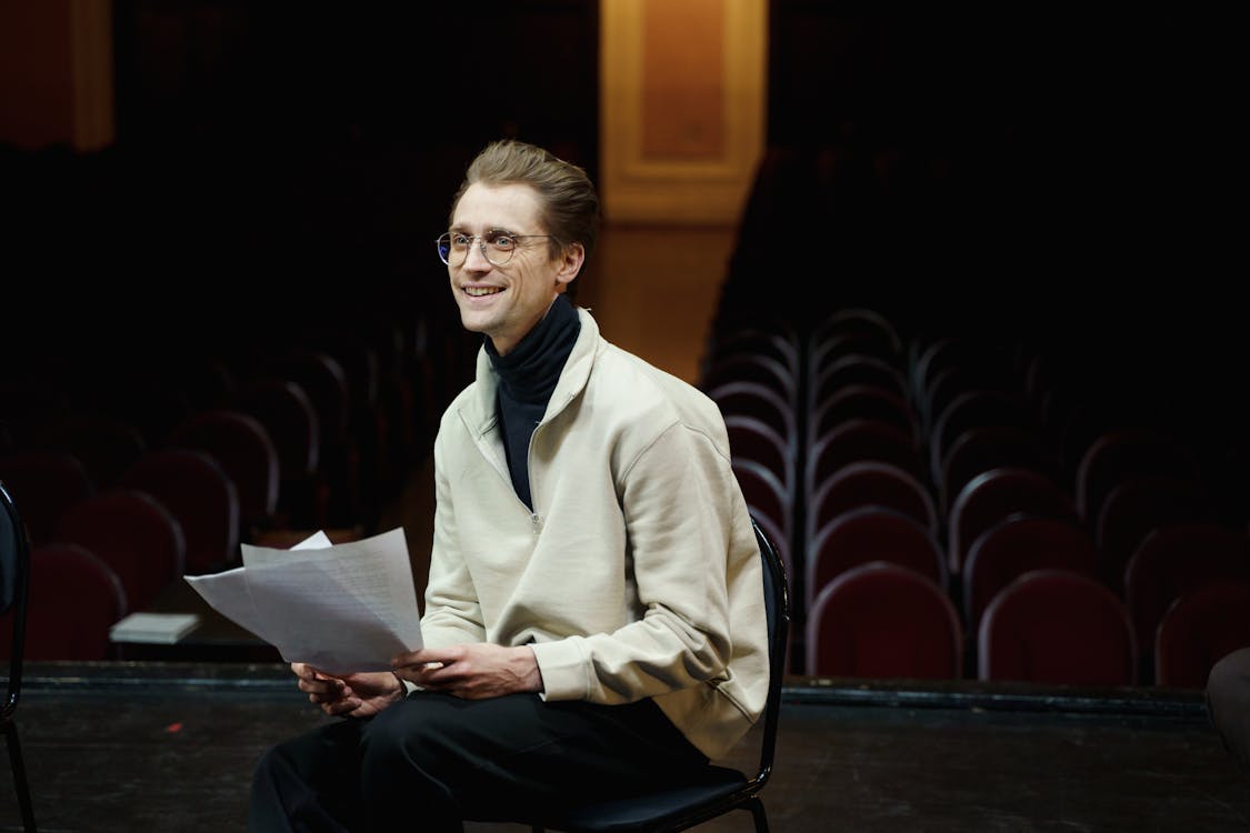 Man reading a script for an audition.