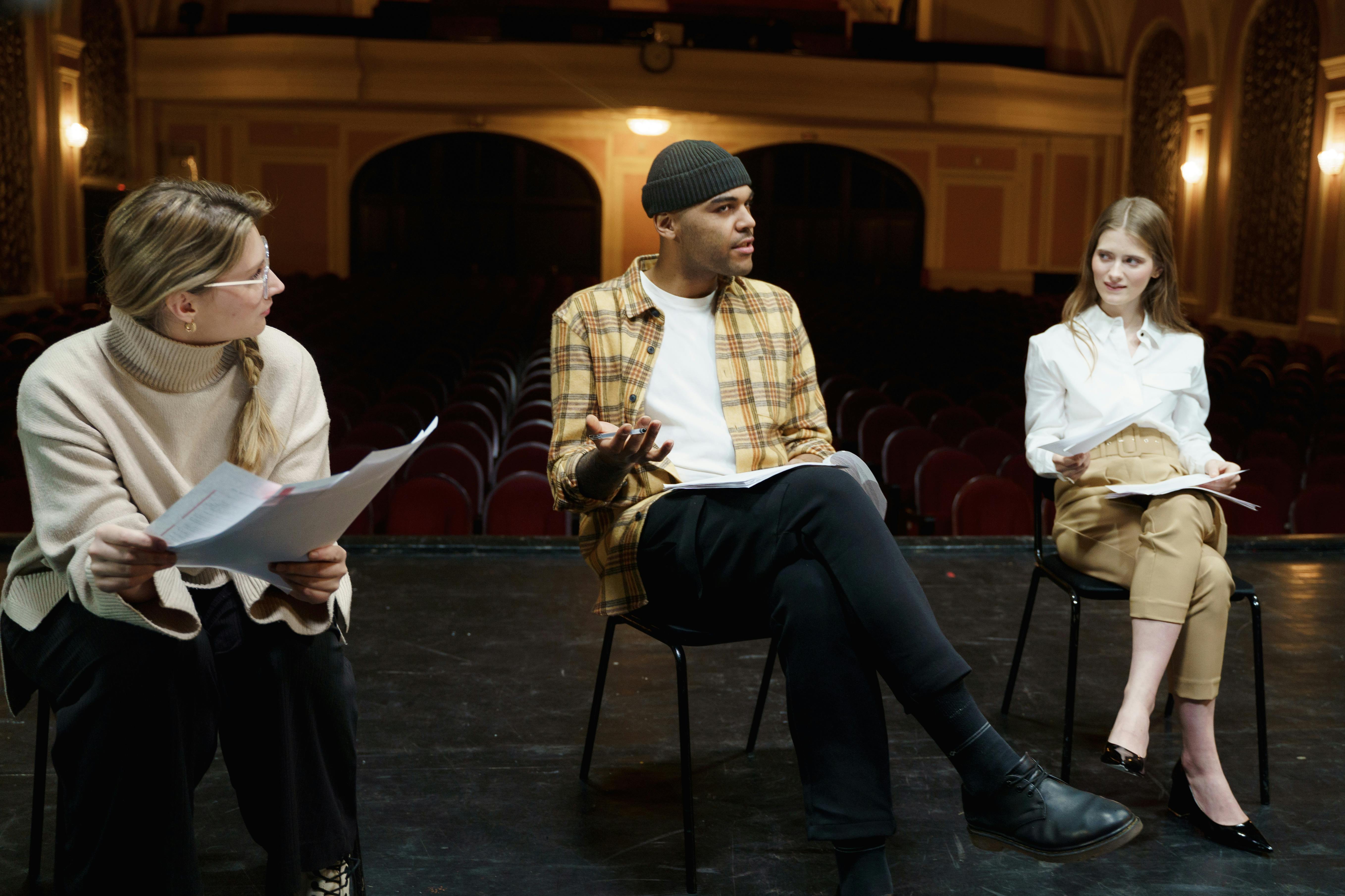 three people having a discussion