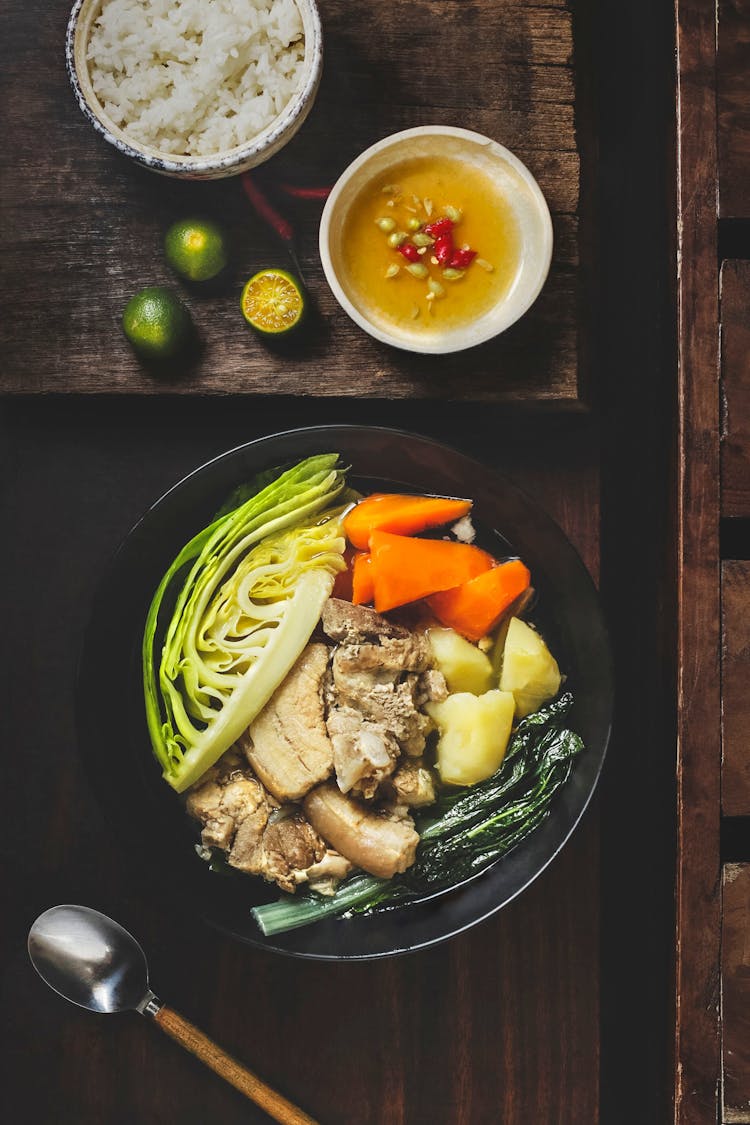 Tasty Dish With Vegetables And Meat In Bowl Near Rice