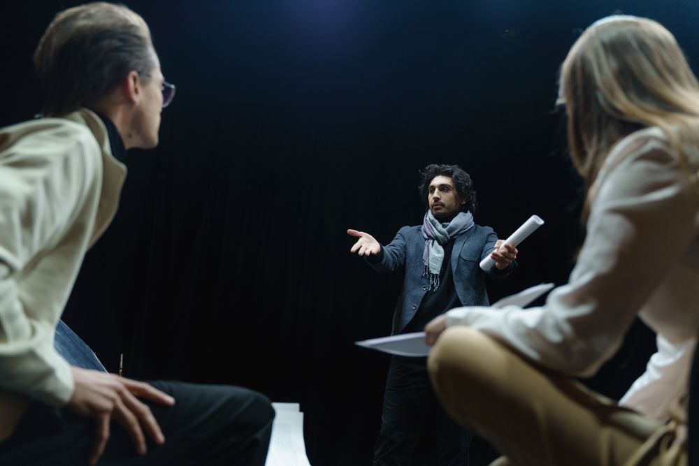 Acting coach discussing a scene with two students