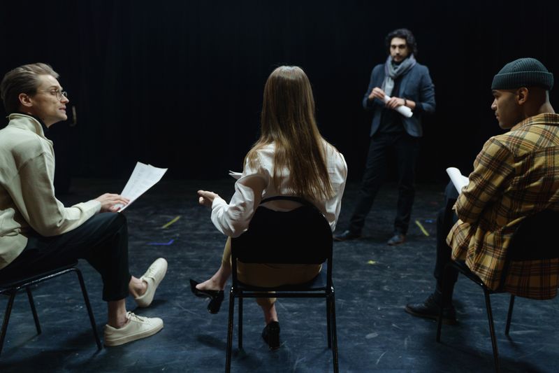 Small group of acting students collaborating on an improv scene