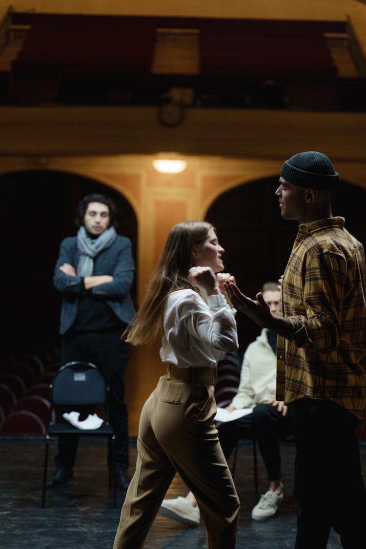 Man And Woman Acting On Stage