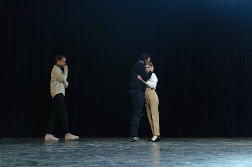 Three People On Stage