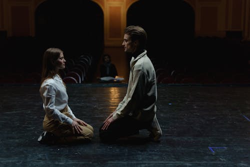 Man And Woman Sitting Face to Face With Each Other