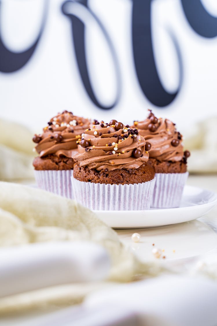 Chocolate Cupcakes With Icing Sprinkled With Chocolate Beads