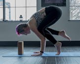 A Woman Balancing Her Body Using Her Hands