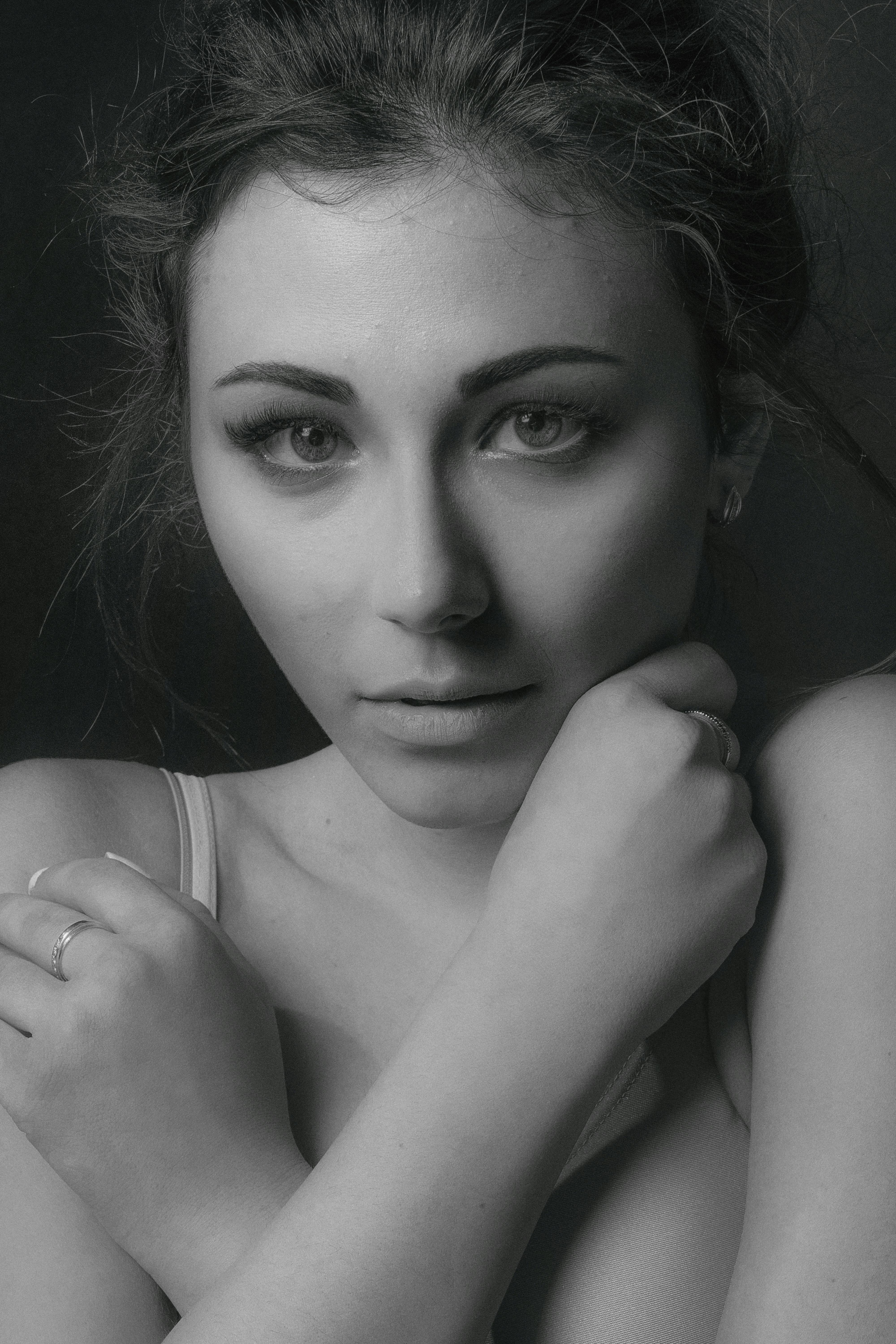 Striking monochrome portrait of a young woman conveying elegance and depth.