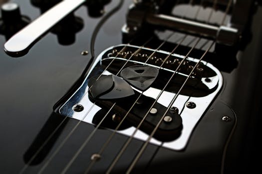 Detailed shot of an electric guitar with picks and strings. Perfect for music and instrument themes.