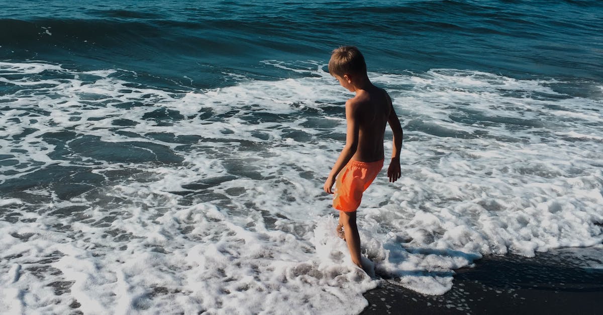 Free stock photo of beach, blue water, little boy