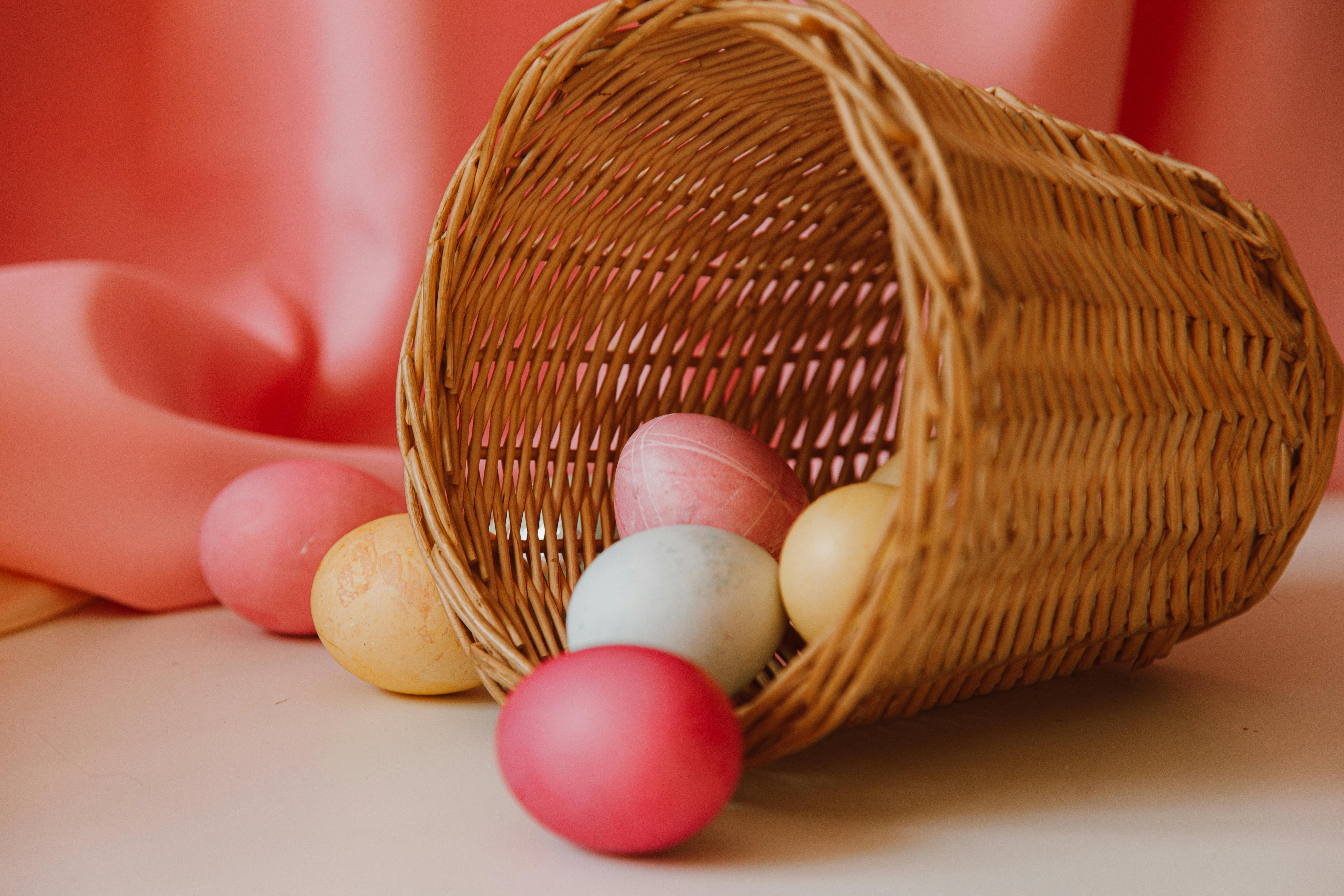 colored eggs in a basket