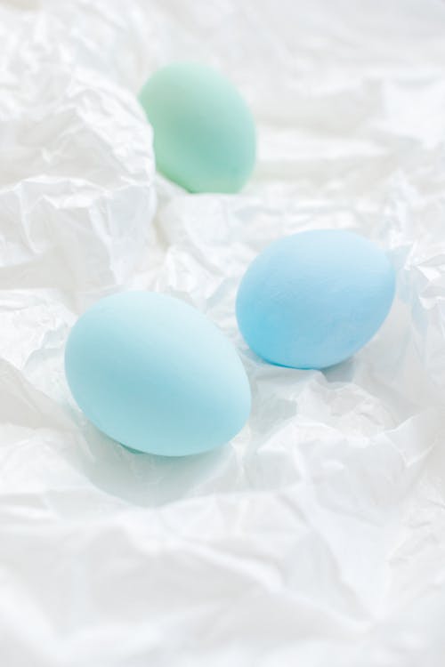 Blue Colored Eggs On White Paper