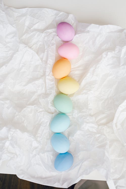 Assorted Colored Eggs On White Paper