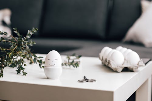 White Egg on White Ceramic Cup