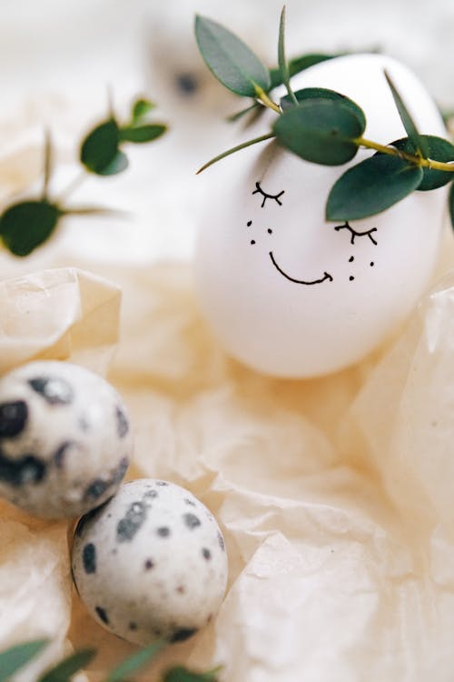 Free Painted Smiley Face On White Egg Stock Photo