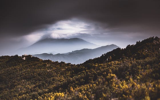 Misty view of Pico del Teide under stormy skies in Tenerife, Spain.