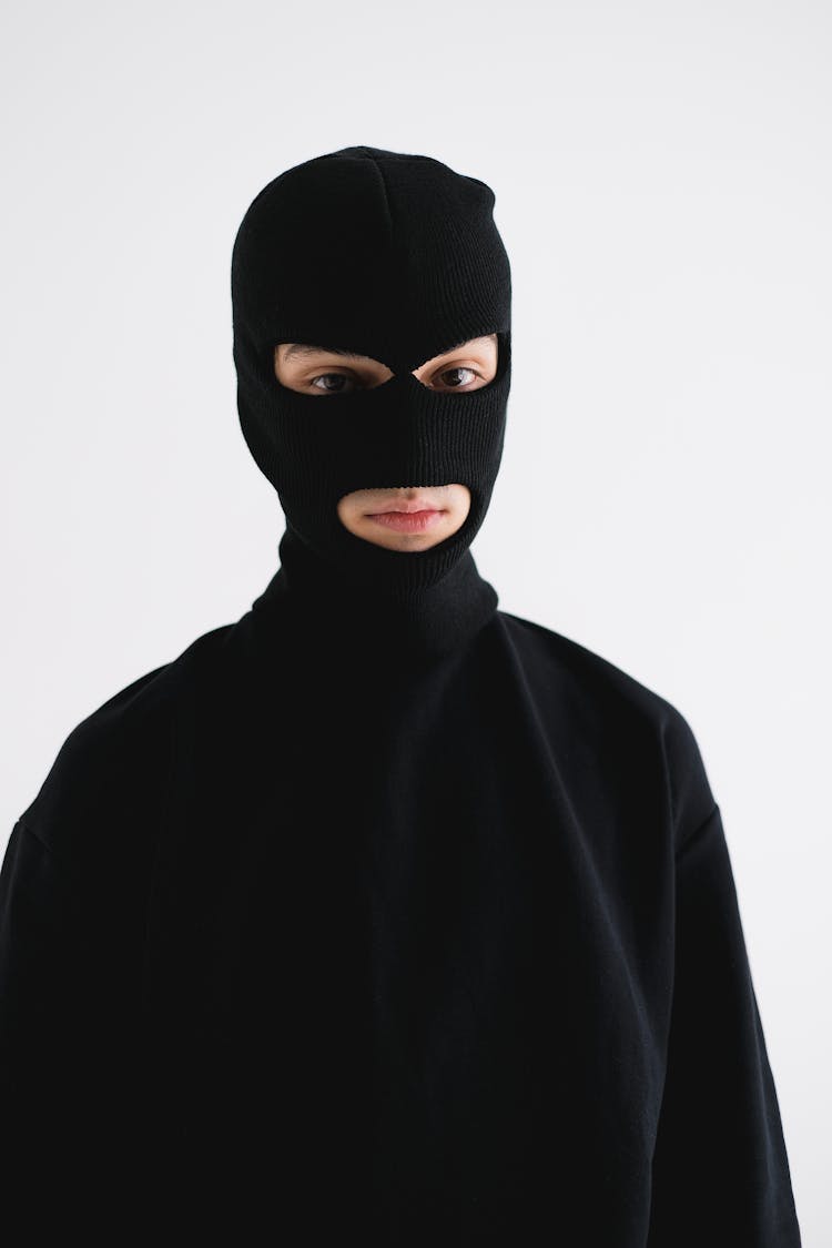 Portrait Of A Man Wearing All Black And A Balaclava 