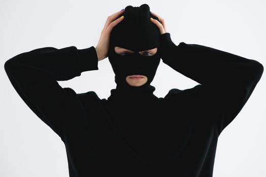 Close-Up Shot of a Person Wearing a Robber Mask
