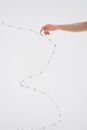 A Person Touching the Spike of a Barbed Wire