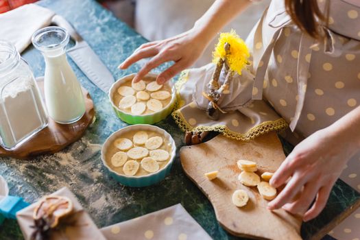 Close-up of homemade banana pie preparation with milk and flour.