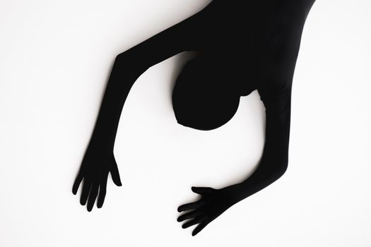 Minimalist abstract silhouette of a person on a white background.