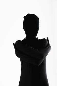 Artistic silhouette of a person hugging themselves on a white background.