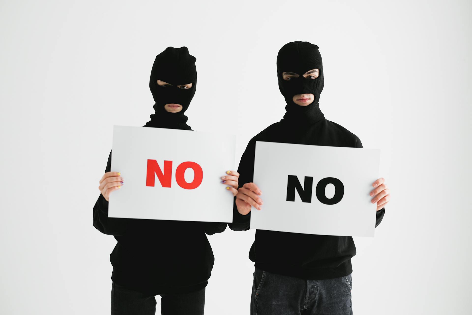 Men Holding Posters