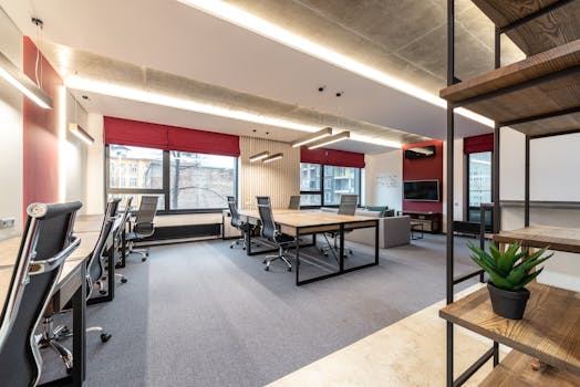 Spacious and contemporary office interior with natural lighting and minimal decor.