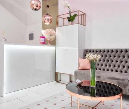 Modern lobby interior with furniture and decorative lamps