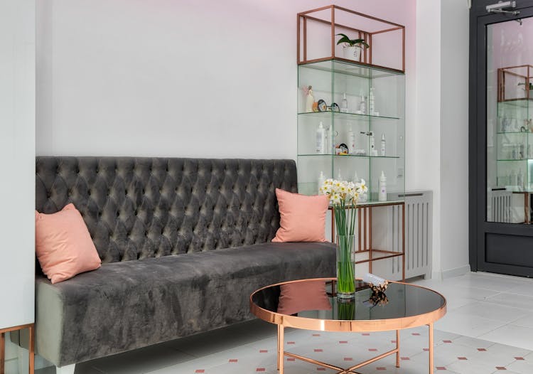 Modern Foyer Interior With Sofa Against Flowers In Vase