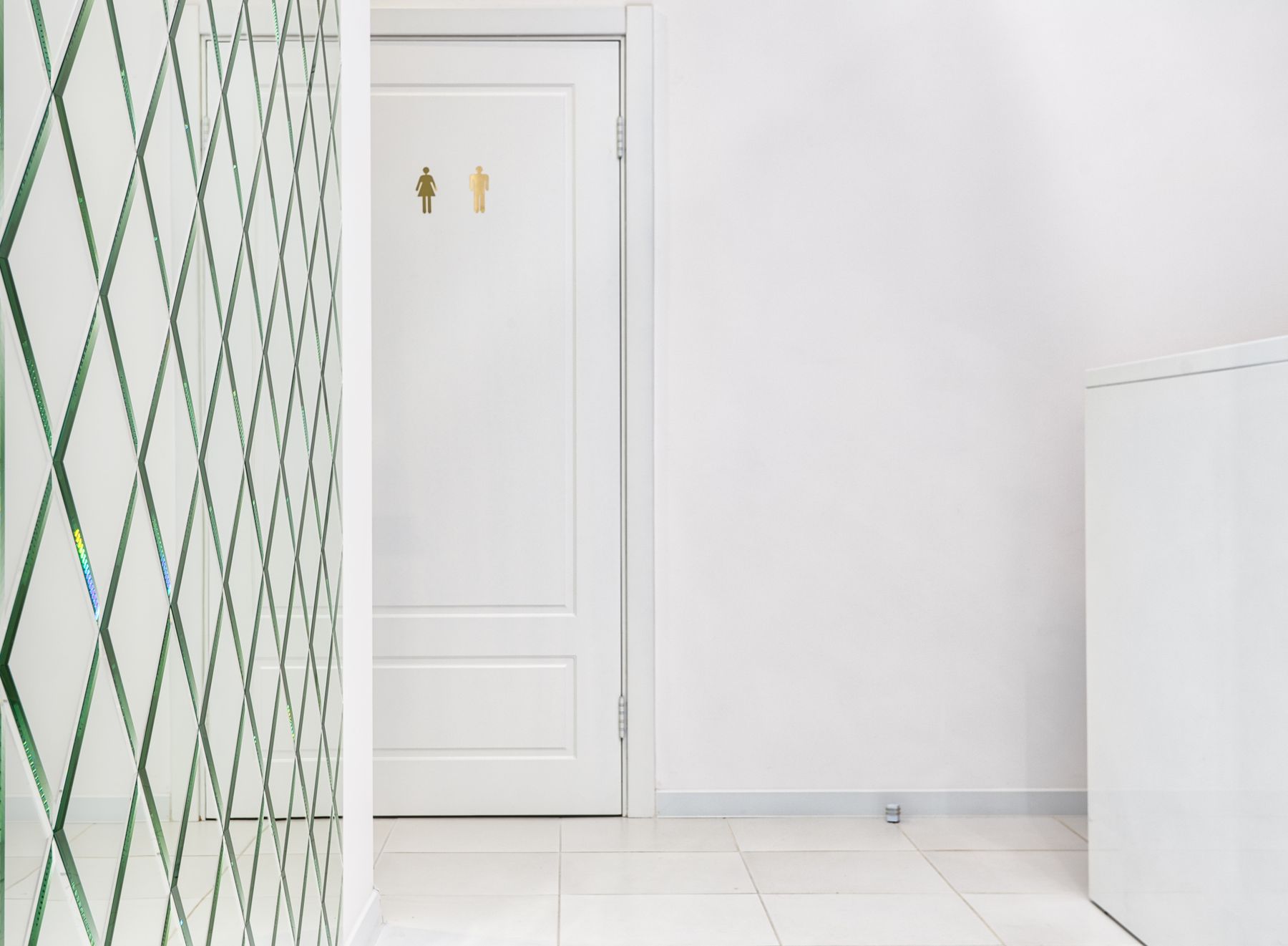 Bathroom with a closed interior door creating privacy between functional zones