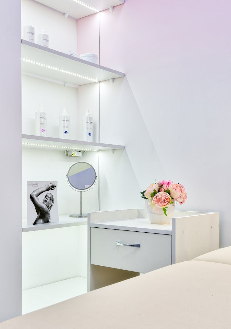 Skincare Products On Shelves In Beauty Salon