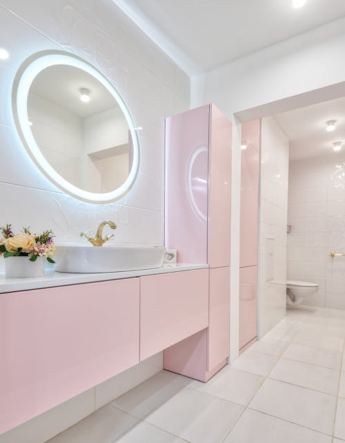 Interior of modern bathroom with glowing mirror