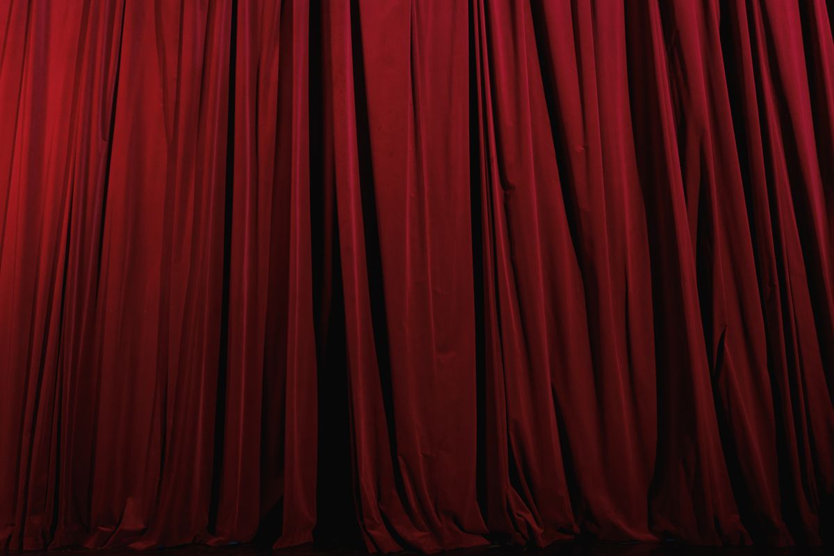 Red pleated curtain on a theatre stage