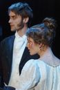 Man in Black Suit And Woman In White Dress
