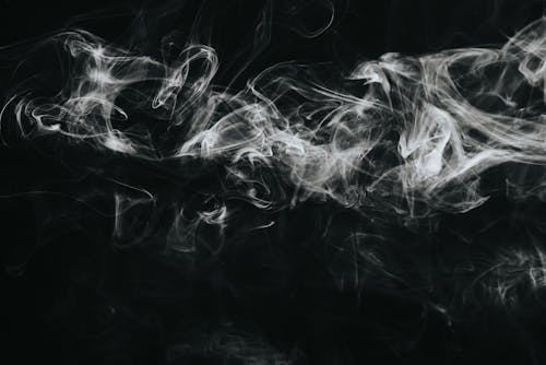 White smoke against black background