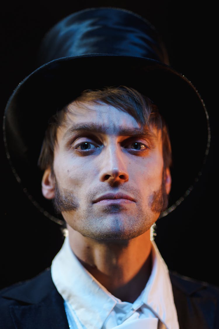 Man In Black Top Hat And White Dress Shirt