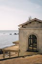 White and Brown Wooden House on Beach