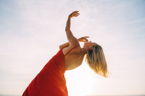 Free Photo of a Woman Raising Her Arm while Dancing Stock Photo