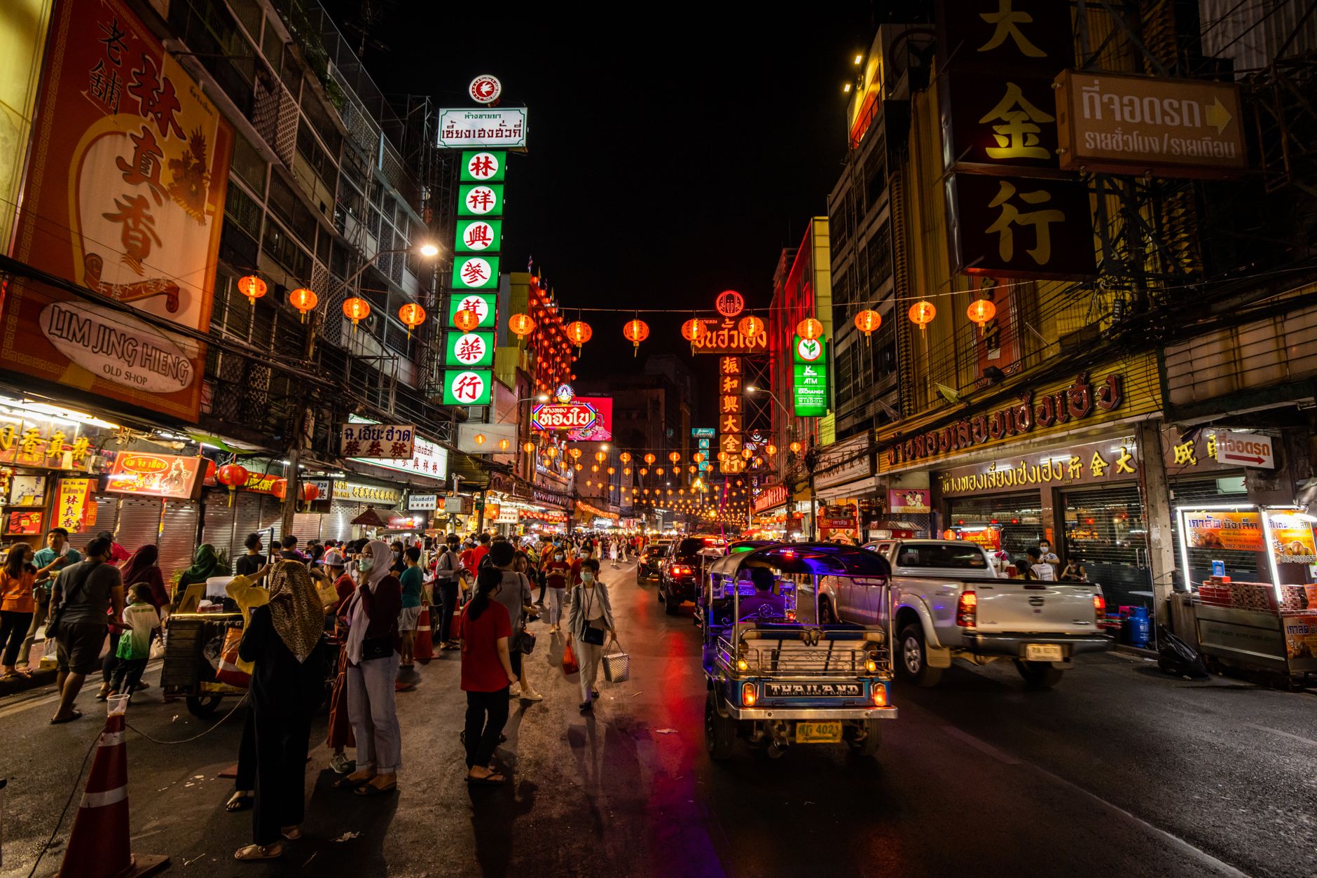 Yaowarat Road in Chinatown at night with neon signs and street food stalls