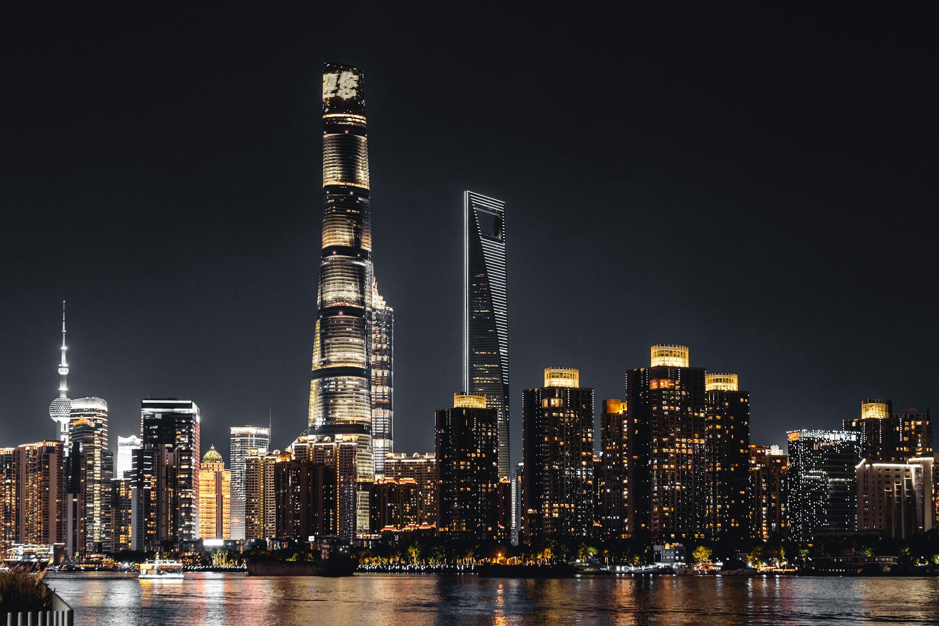 Shanghai skyline illuminated against the night sky featuring iconic skyscrapers.