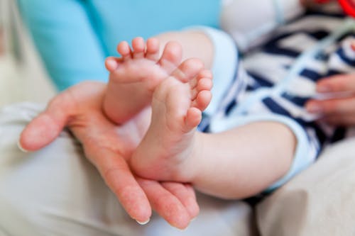 Free Close-Up Photograph of a Baby's Feet Stock Photo