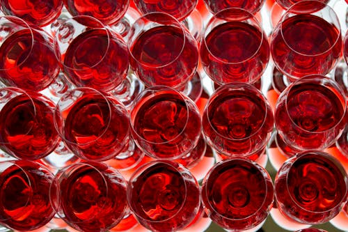 Top View of Wine Glasses with Red Liquid 