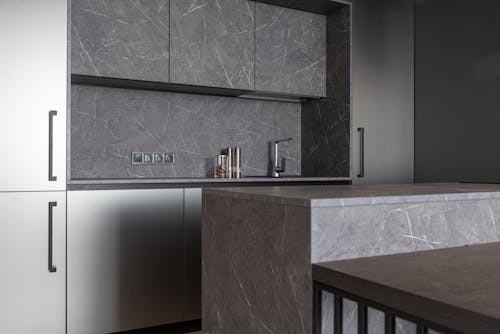 Free Modern kitchen with stylish gray furniture Stock Photo
