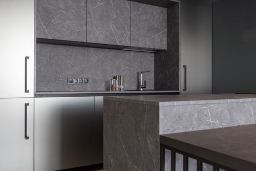 Free Interior of contemporary kitchen with minimalist gray furniture and counter in residential apartment Stock Photo