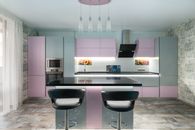 Spacious kitchen with black table and chairs placed near colorful cupboards and modern kitchenware in stylish apartment with window and tulle