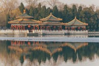 Brown and White Gazebos Near Body of Water