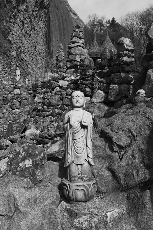 Grayscale Photo of a Buddha Statue
